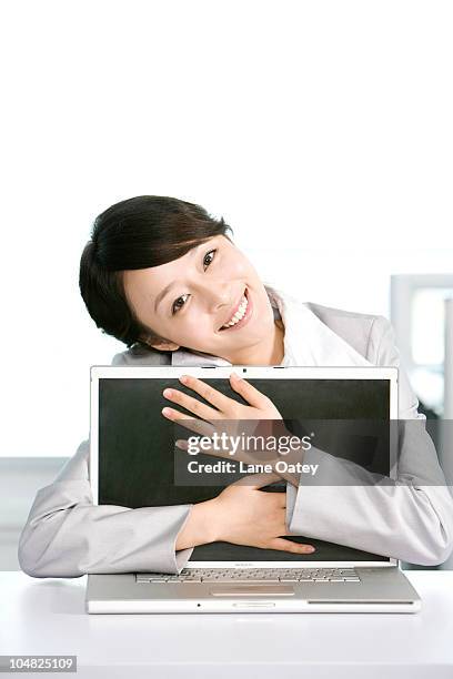 Office Worker Hugging Her Computer High-Res Stock Photo - Getty Images