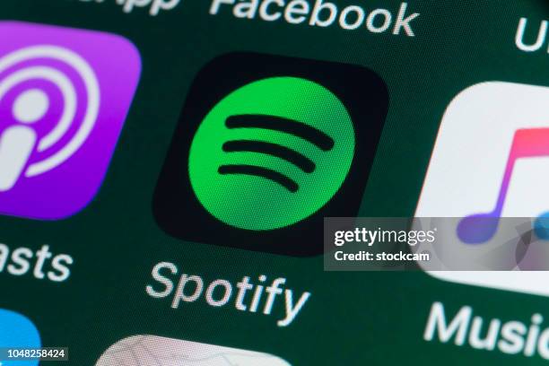 spotify, podcasts, music and other apps on iphone screen - spotify imagens e fotografias de stock