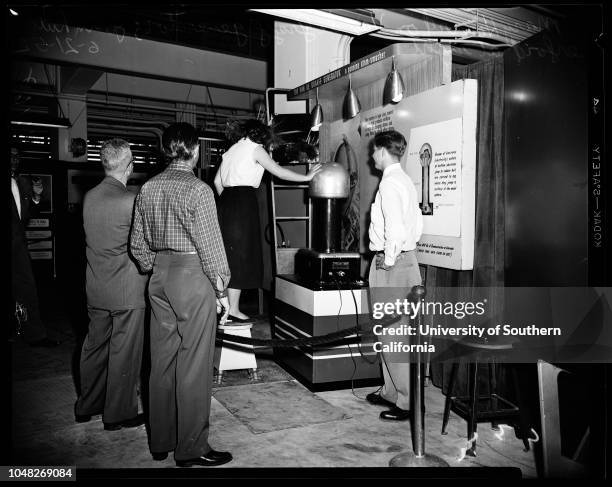 Atomic exhibition, 21 June 1952. Mary Howard - 15 years ;Mrs Sam Williams;Tom Mawhinney ;Jack Aldridge .;Caption slip reads: 'Photographer: Mitchell....