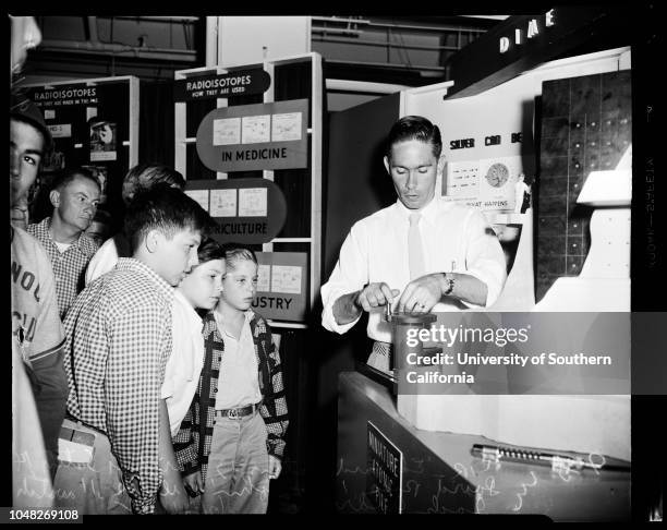 Atomic exhibition, 21 June 1952. Mary Howard - 15 years ;Mrs Sam Williams;Tom Mawhinney ;Jack Aldridge .;Caption slip reads: 'Photographer: Mitchell....