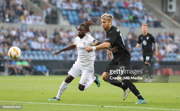 Dieumerci Ndongala and Rasmus Bengtsson fight for the ball during the UEFA Europa League Group I match between KRC Genk and Malmo at Cristal Arena on...