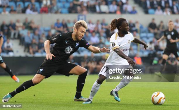 Rasmus Bengtsson and Dieumerci Ndongala fight for the ball during the UEFA Europa League Group I match between KRC Genk and Malmo at Cristal Arena on...