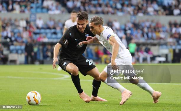 Andreas Vindheim and Leandro Trossard fight for the ball during the UEFA Europa League Group I match between KRC Genk and Malmo at Cristal Arena on...