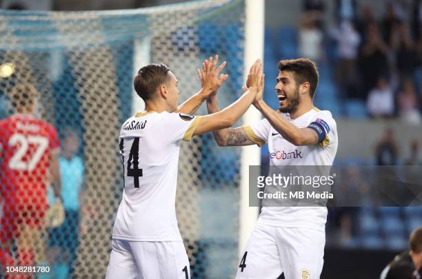 Leandro Trossard celebrates with Alejandro Pozuelo after scoring a goal during the UEFA Europa League Group I match between KRC Genk and Malmo at...