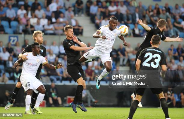 Rasmus Bengtsson and Ally Samatta fight for the ball during the UEFA Europa League Group I match between KRC Genk and Malmo at Cristal Arena on...