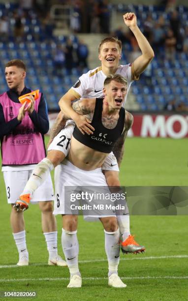 Sebastien Dewaest and Jere Uronen celebrate after winning the UEFA Europa League Group I match between KRC Genk and Malmo at Cristal Arena on...