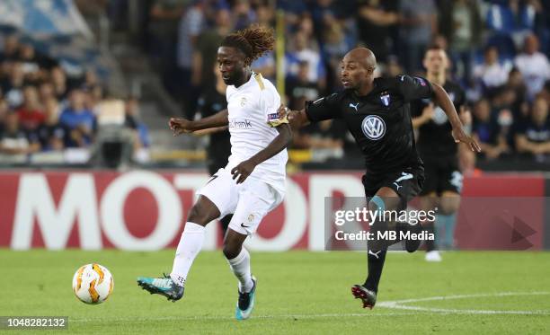 Dieumerci Ndongala and Fouad Bachirou fight for the ball during the UEFA Europa League Group I match between KRC Genk and Malmo at Cristal Arena on...