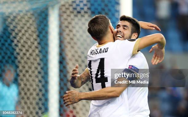 Leandro Trossard celebrates with Alejandro Pozuelo after scoring a goal during the UEFA Europa League Group I match between KRC Genk and Malmo at...