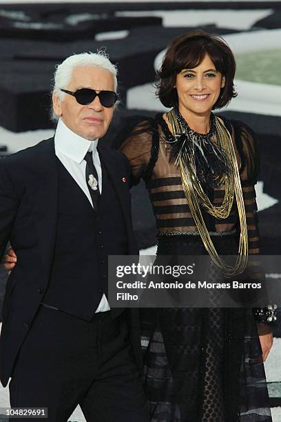 Karl Lagerfeld and Ines de la Fressange walk the runway during the Chanel Ready to Wear Spring/Summer 2011 show during Paris Fashion Week at Grand...