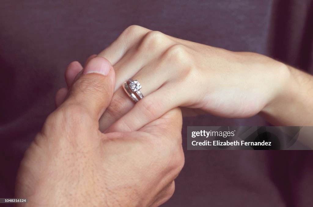 Holding Hands with engagement ring