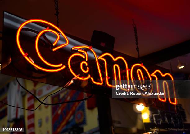 Canon neon sign burns in the window of a camera and electronics store in San Francisco, California.