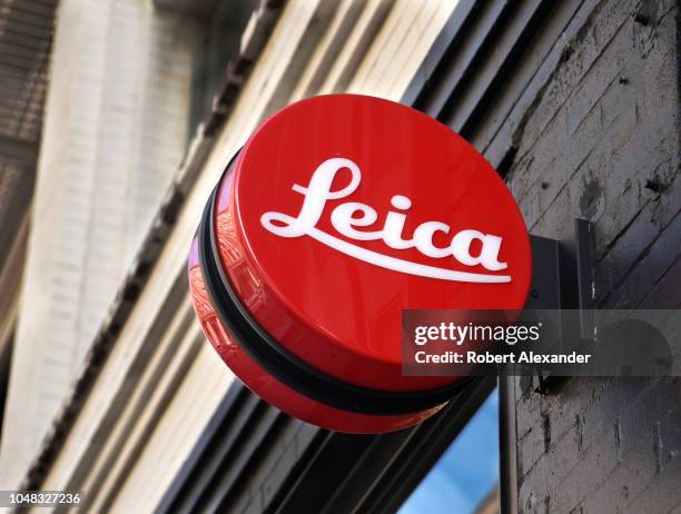 Business sign in the shape of the round Leica logo over the entrance to a Leica camera shop in San Francisco, California.