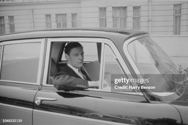 British businessman Angus Ogilvy pictured driving his Vanden Plas Princess car on the morning of his wedding to Princess Alexandra in London on 24th...