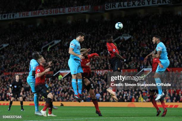 Federico Fernandez of Newcastle goes up for a header with Paul Pogba of Man Utd during the Premier League match between Manchester United and...