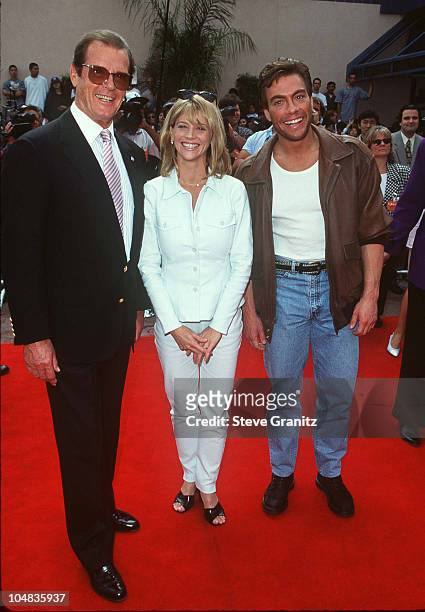 Roger Moore, Janet Gunn and Jean-Claude Van Damme during The Quest Premiere at Cineplex Odeon Universal Studios Cinema in Universal City, California,...