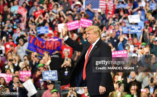President Donald Trump arrives to speak at a "Make America Great Again" rally at the Mid-America Center in Council Bluffs, Iowa on October 9, 2018.