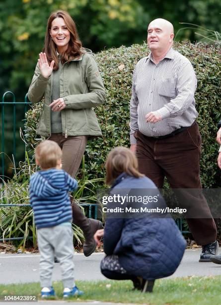 Catherine, Duchess of Cambridge waves to members of the public as she visits Sayers Croft Forest School and Wildlife Garden on October 2, 2018 in...