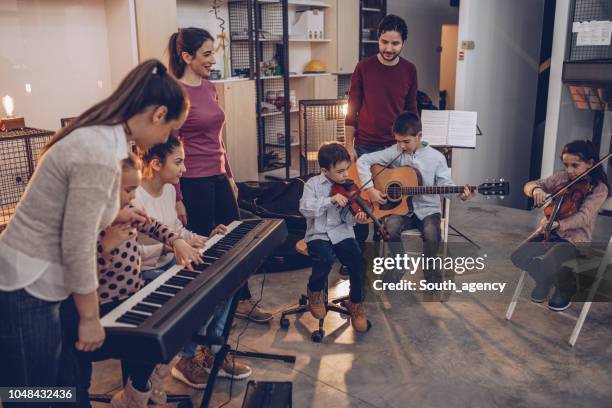 kids in music school - music rehearsal stock pictures, royalty-free photos & images