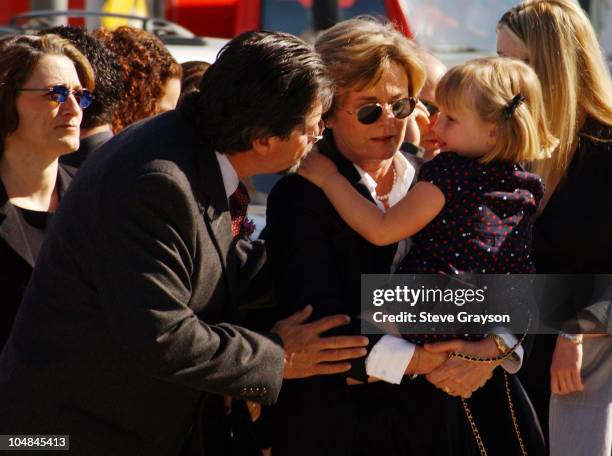 Heather Menzies, widow of actor Robert Urich, and their daughter enter the chruch for funeral services for the actor, April 19, 2002.