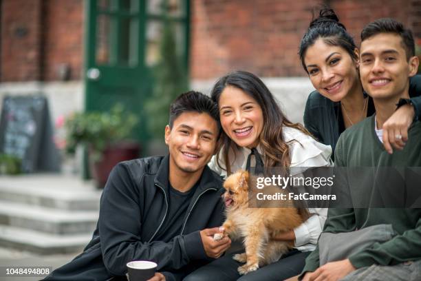 latino/hispanic familienfoto von vier schönen menschen - cousins stock-fotos und bilder