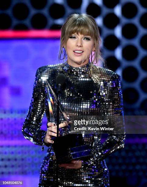 Taylor Swift accepts Artist of the Year onstage during the 2018 American Music Awards at Microsoft Theater on October 9, 2018 in Los Angeles,...