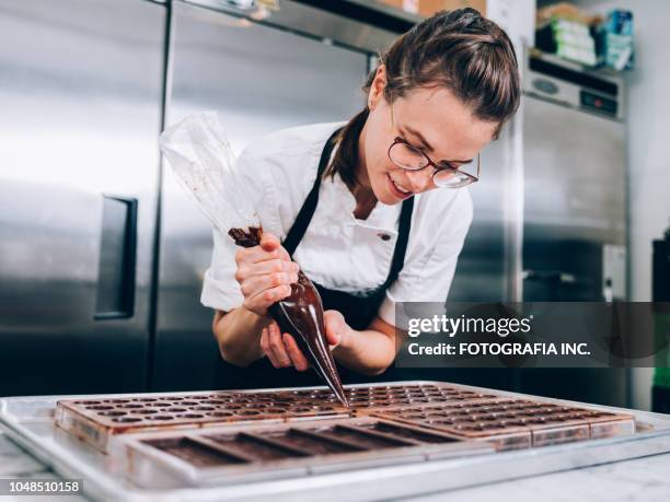 young master chocolatier - bakery apron stock pictures, royalty-free photos & images