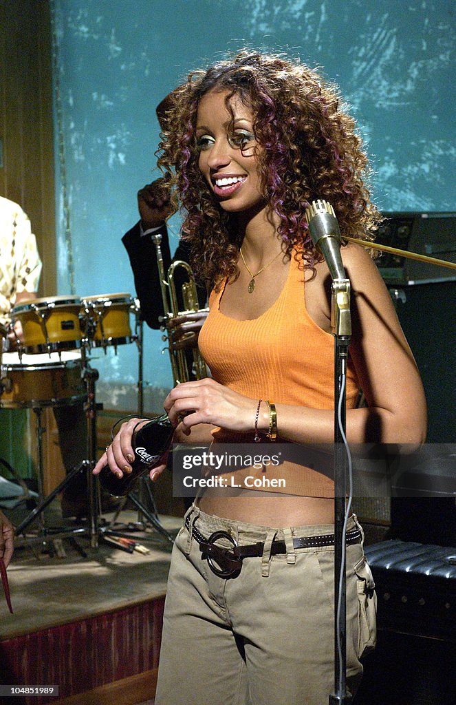 Common Rapper Mya R&B star Mya drinks down a Coca-Cola on the shoot of