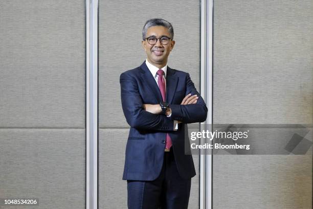 Tengku Zafrul Abdul Aziz, chief executive officer of CIMB Group Holdings Bhd., poses for a photograph after a Bloomberg Television interview at the...