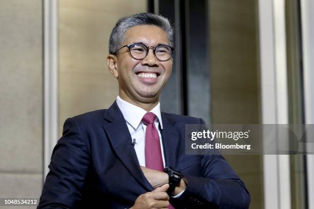 Tengku Zafrul Abdul Aziz, chief executive officer of CIMB Group Holdings Bhd., reacts during a Bloomberg Television interview at the New Dawn...