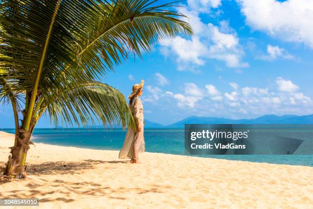 woman at tropical - tropical tree stock pictures, royalty-free photos & images