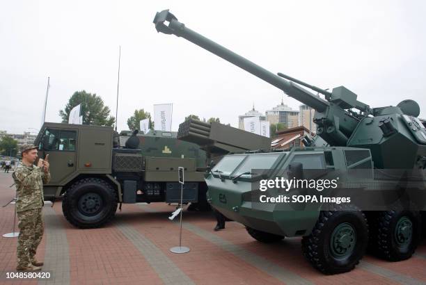 Ukrainian soldier seen taking photos of military vehicles during the Arms and Security 2018 international exhibition in Kiev, Ukraine. The exhibition...