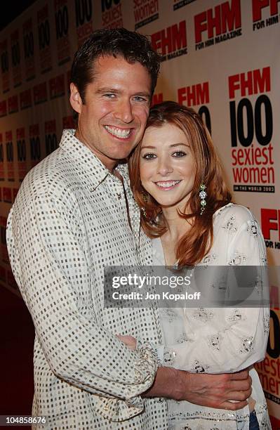 Alyson Hannigan and fiance Alexis Denisof during FHM's "100 Sexiest Women in the World" Party Co-Sponsored by Smirnoff Vodka at Raleigh Studios in...