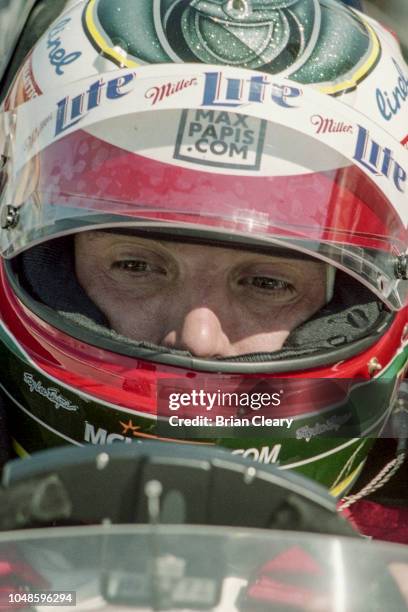 Max Papis of Italy sits in his car during the Marlboro Grand Prix of Miami, CART race, on March 26, 2000 in Homestead, Florida.