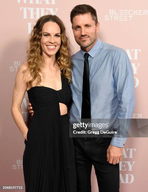 Actress Hilary Swank and husband Philip Schneider arrive at the Los Angeles Special Screening Of "What They Had" at iPic Westwood on October 9, 2018...