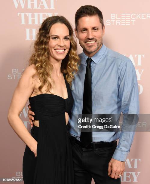 Actress Hilary Swank and husband Philip Schneider arrive at the Los Angeles Special Screening Of "What They Had" at iPic Westwood on October 9, 2018...
