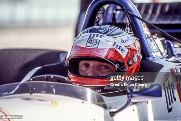 Max Papis of Italy sits in his car during the Marlboro Grand Prix of Miami, CART race, on March 26, 2000 in Homestead, Florida.