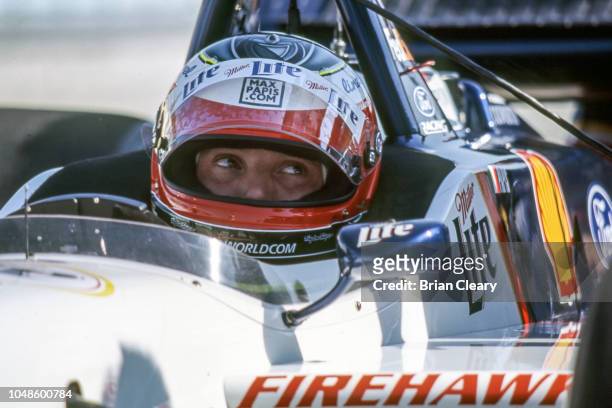 Max Papis of Italy sits in his car during the Marlboro Grand Prix of Miami, CART race, on March 26, 2000 in Homestead, Florida.