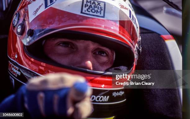 Max Papis of Italy sits in his car during the Marlboro Grand Prix of Miami, CART race, on March 26, 2000 in Homestead, Florida.