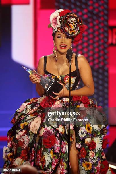 Cardi B accepts the Favorite Artist - Rap/Hip-Hop award onstage during the 2018 American Music Awards at Microsoft Theater on October 9, 2018 in Los...