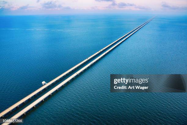 lake pontchartrain causeway aerial - length concept stock pictures, royalty-free photos & images