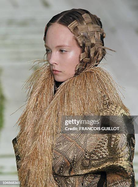 Model presents a creation by British designer Sarah Burton for Alexander McQueen during the Spring/Summer 2011 ready-to-wear collection show on...