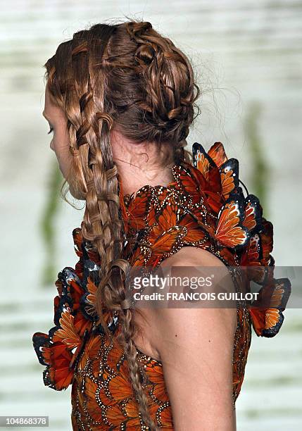 Model presents a creation by British designer Sarah Burton for Alexander McQueen during the Spring/Summer 2011 ready-to-wear collection show on...