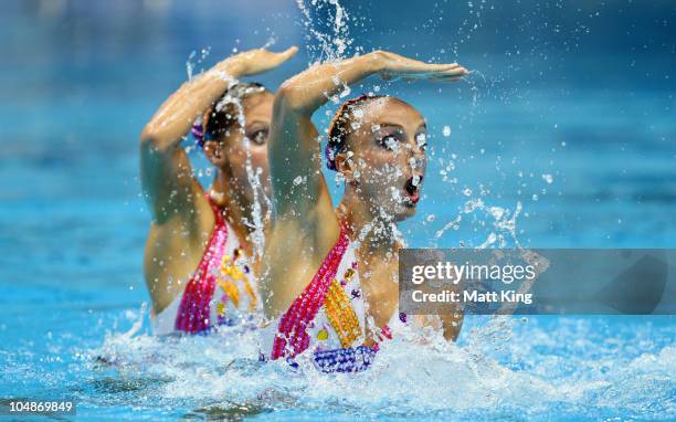 The pairing of Chloe Isaac and Marie-Pier Boudreau-Gagnon of Canada compete in the Duet Technical Routine at the Dr S.P. Mukherjee Aquatics Complex...