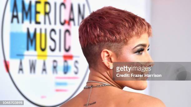 Halsey, hair, necklace, and tattoo details, attends the 2018 American Music Awards at Microsoft Theater on October 9, 2018 in Los Angeles, California.