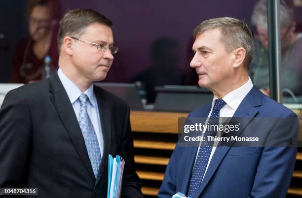 Euro & Social Dialogue Commissioner Valdis Dombrovskis is talking with the EU Digital Single Market Commissioner Andrus Ansip prior to the weekly...