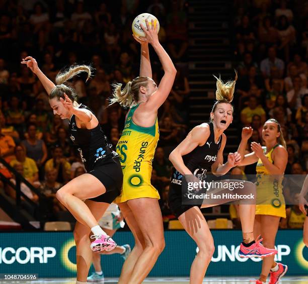 Caitlin Bassett of the Diamonds catches the ball between Jane Watson and Katrina Grant of the Silver Ferns during the Constellation Cup match between...