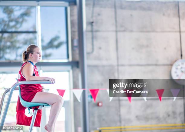 watchful lifeguard - lifeguard stock pictures, royalty-free photos & images