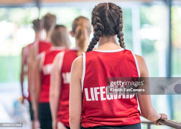 lifeguards in a line - life guard stock pictures, royalty-free photos & images