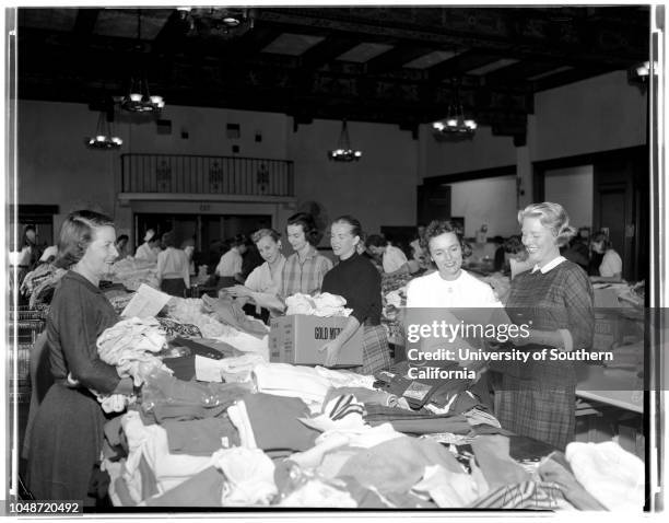 Needlework Guild of America gather and distribute garments for needy, 30 October 1957. Mrs M.V Kelley, Jr.;Mrs Phillip Bassett;Mrs Roy Bushee;Mrs...