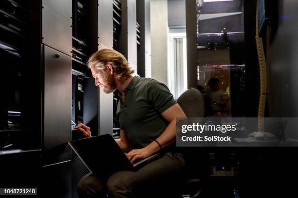 computer server technician at work - network server man stock pictures, royalty-free photos & images